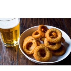 Bread crumbed slices of sweet onion. The carbonation in the beer leads to a very crispy and fluffy result. Served hot with dips of your choice or plain.